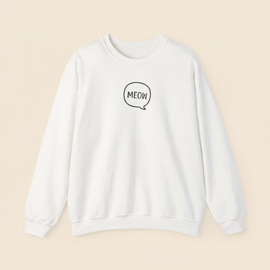 White sweatshirt with 'MEOW' text on a tan background