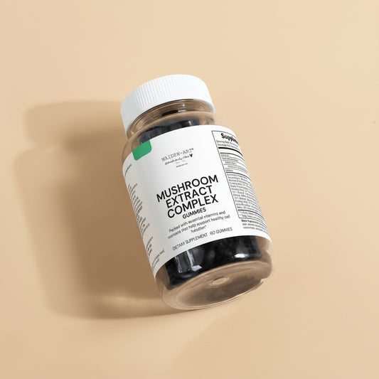 Bottle of Mushroom Extract Complex Gummies on a light tan background