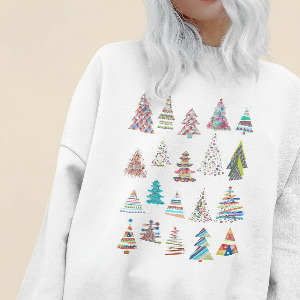 White sweatshirt with colorful Christmas tree patterns on a plain background