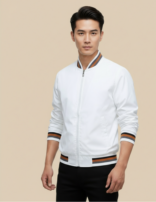 male model wearing white jacket in front of tan background.