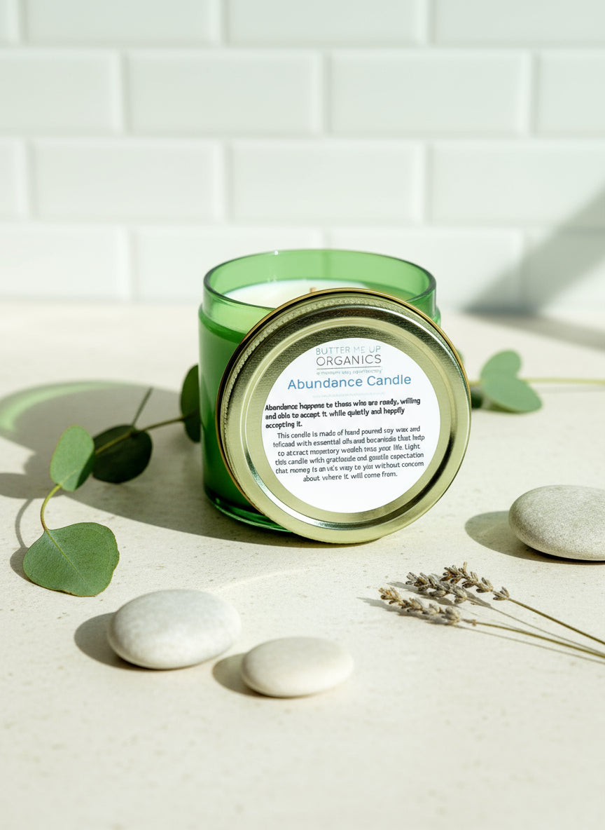 Candle jar lid with 'Organics' branding and text on a white tile background
