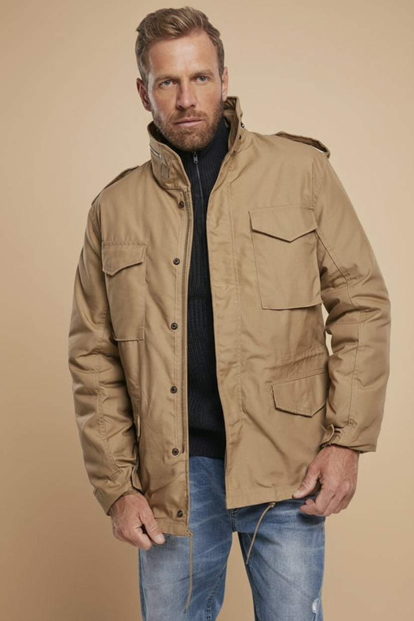 Man wearing a tan jacket on a tan background