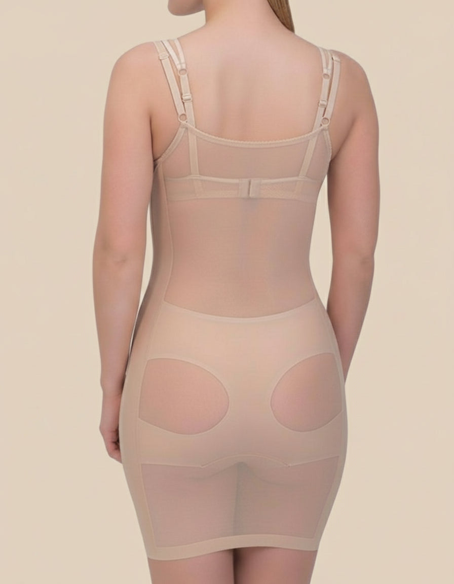Beige shapewear dress worn by a model on a plain background.