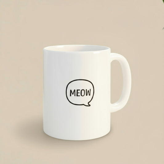 White mug with 'MEOW' text on a coaster, surrounded by kitchen items.