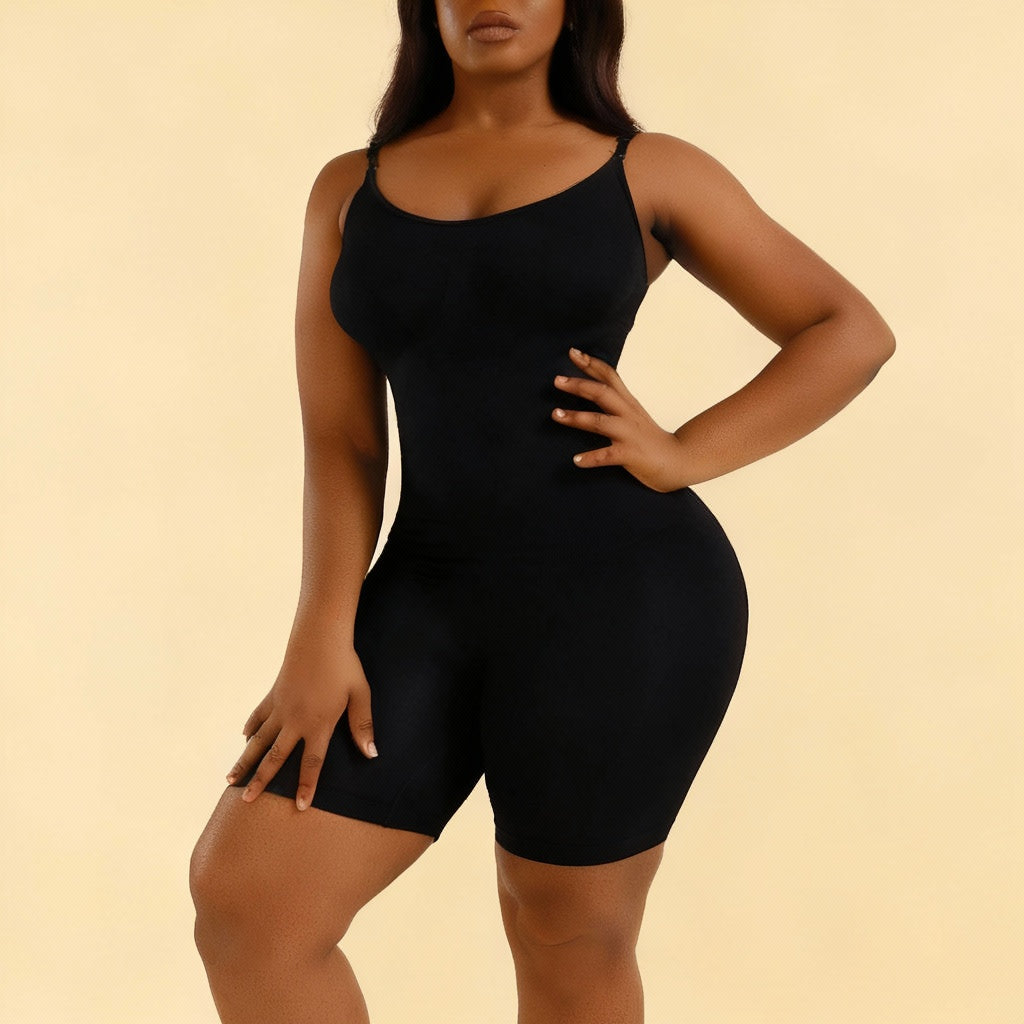 Black bodysuit worn by a model on a tan background