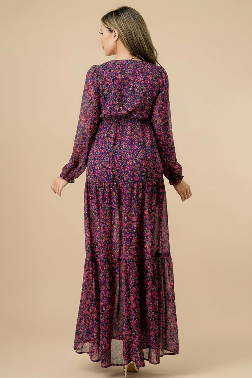 Woman wearing a long, patterned dress on a tan background