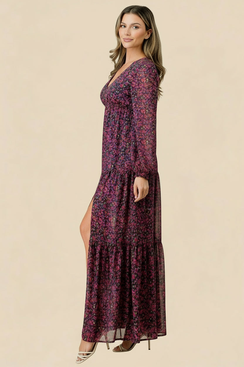Woman wearing a floral dress with a slit on a tan background