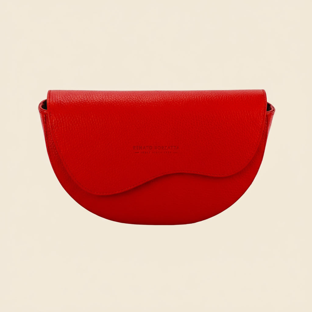 Red handbag with a visible brand name on a tan background