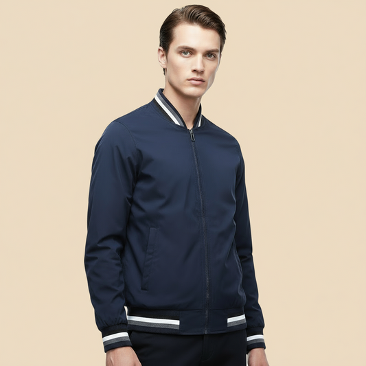 model wearing navy blue jacket with white accents on a tan background