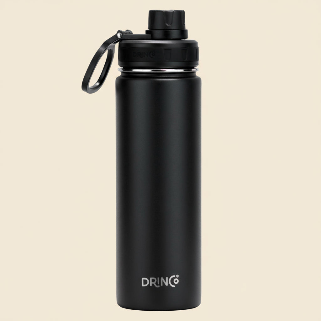 Black water bottle with DRINCO logo on a tan background
