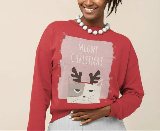 Person wearing a red 'Meowy Christmas' sweater with a cat graphic on a plain background