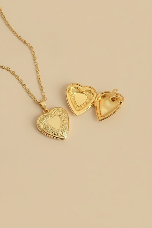 Gold heart-shaped necklaces on a tan background 