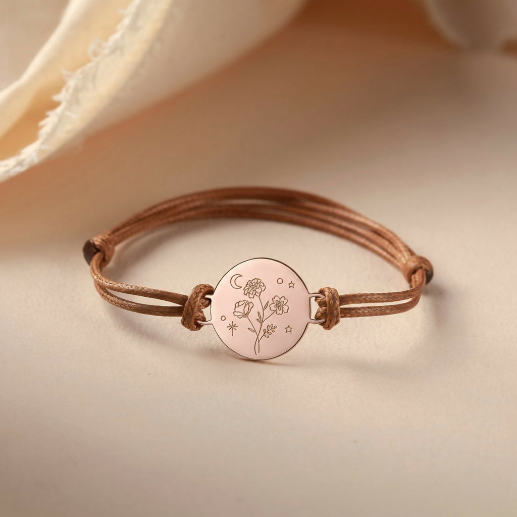 Bracelet with engraved design on a beige background