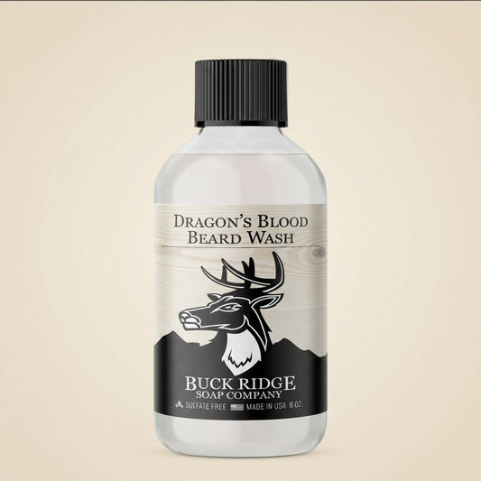 Bottle of Dragon's Blood Beard Wash from Buck Ridge Soap Company on a tan background