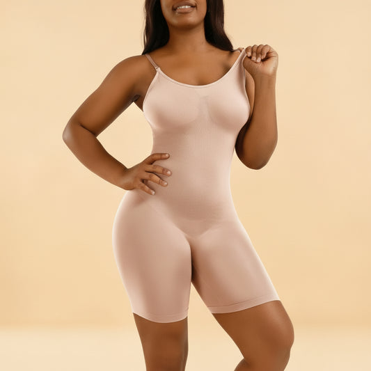 Woman wearing a beige body shaper against a tan background