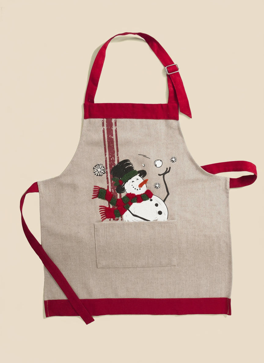 Beige apron with red trim featuring a snowman design on a white background